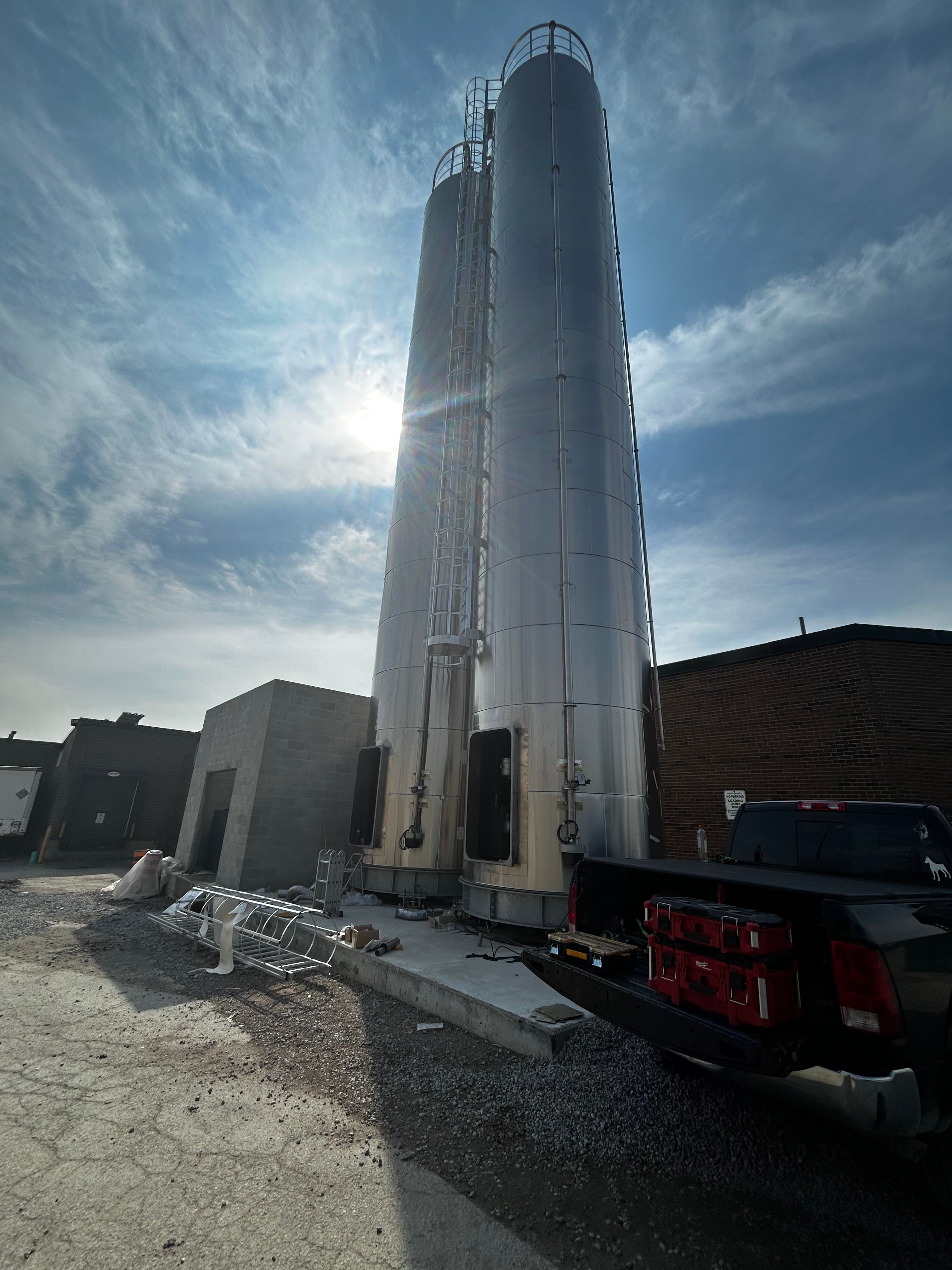 Large industrial silos installed at a manufacturing plant.