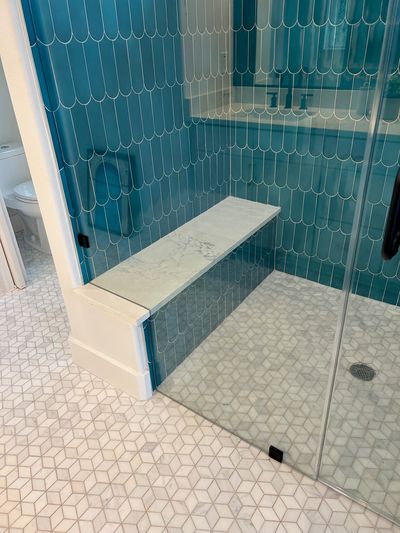 Contemporary shower with aqua tile and hexagon floor in Burnet, Texas