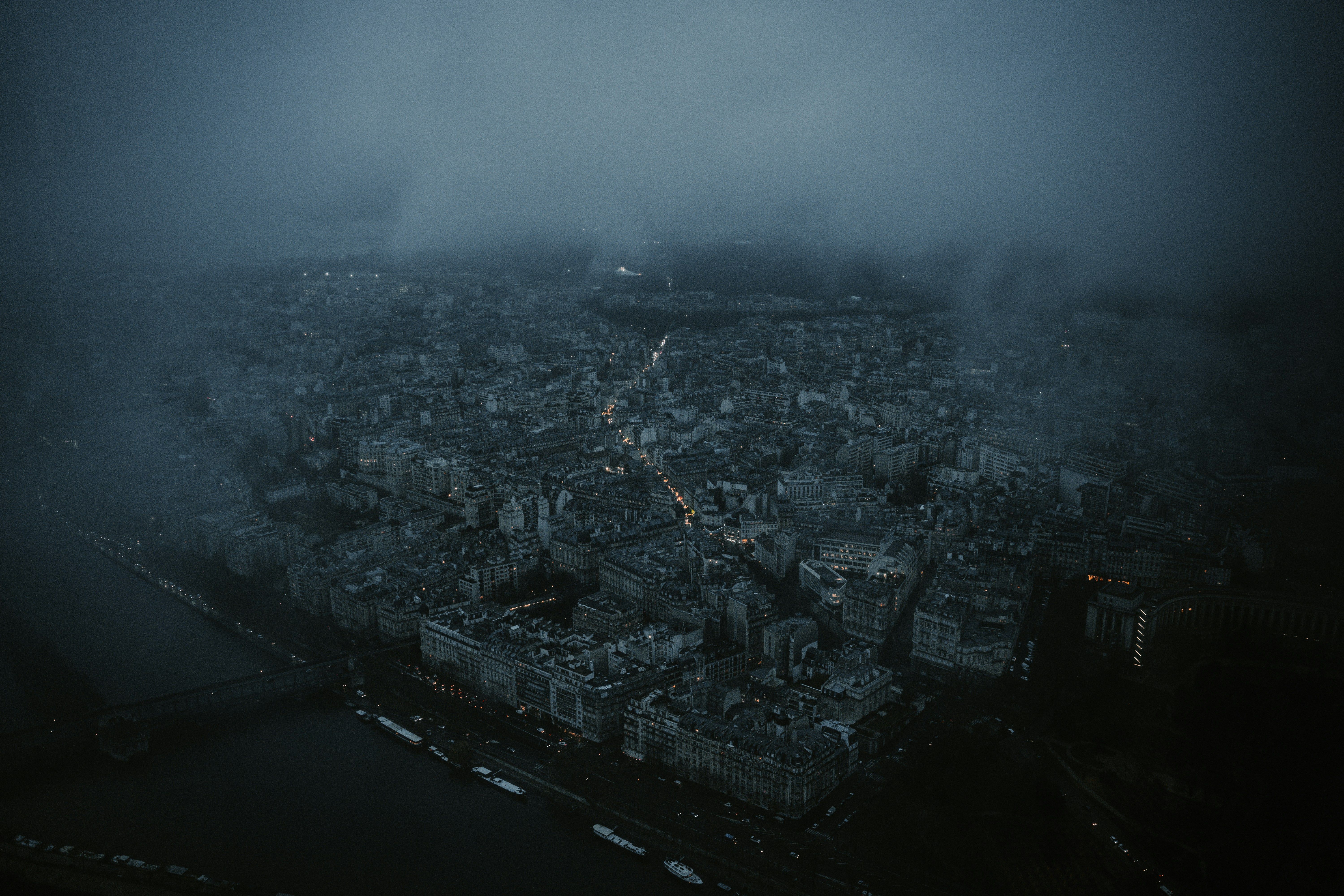 an aerial view of a city in the fog