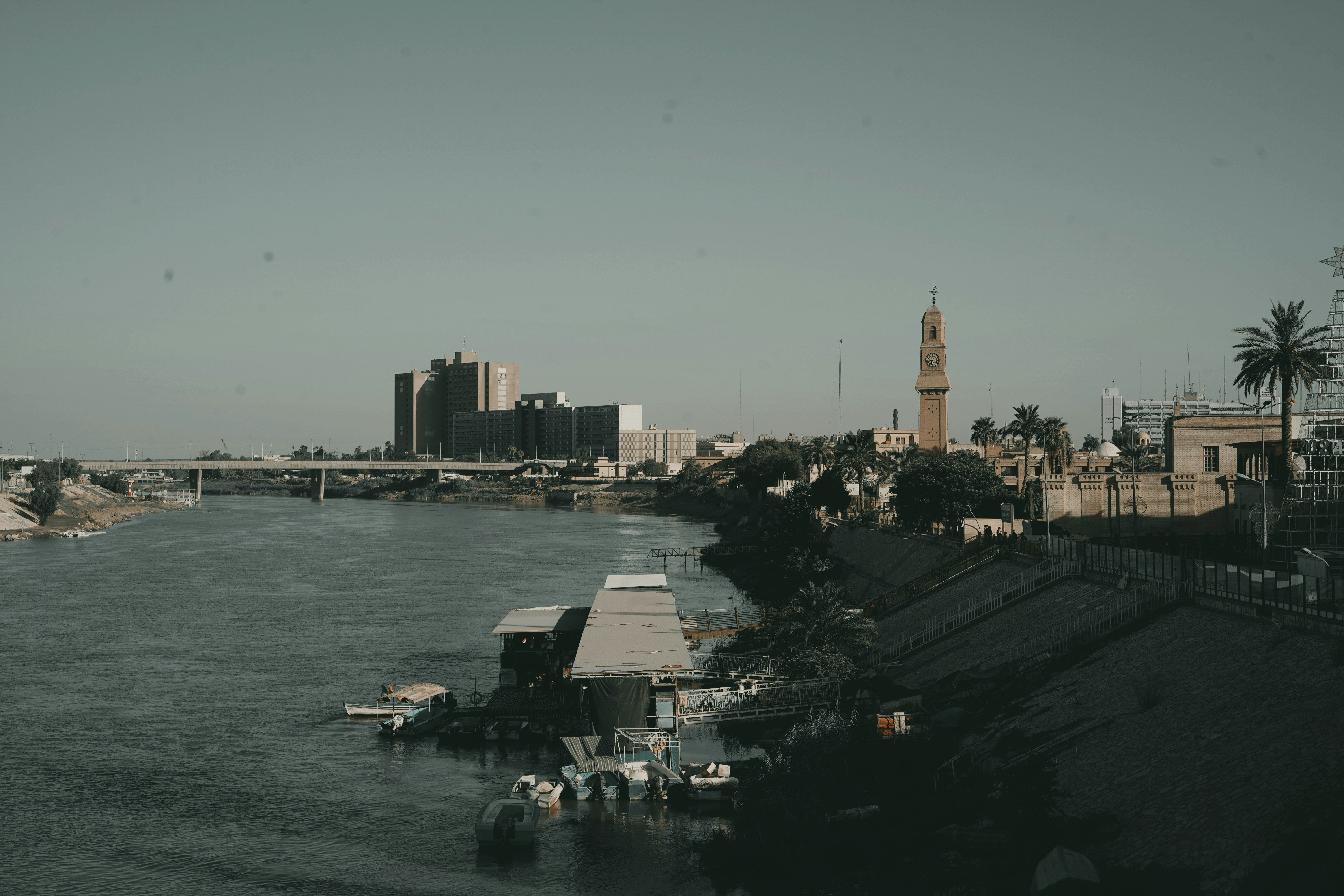 A body of water with a city in the background