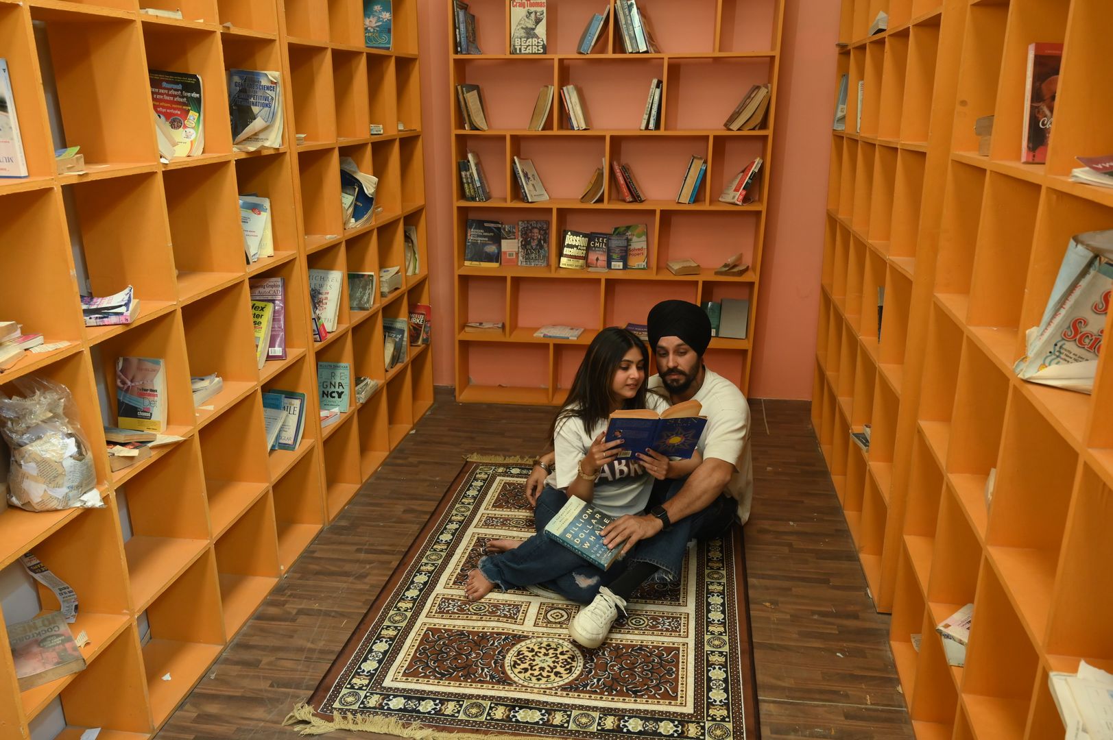 Cozy Library photoshoot set with elegant bookshelves and warm ambiance for sophisticated portrait sessions located in Nagpur SEDO