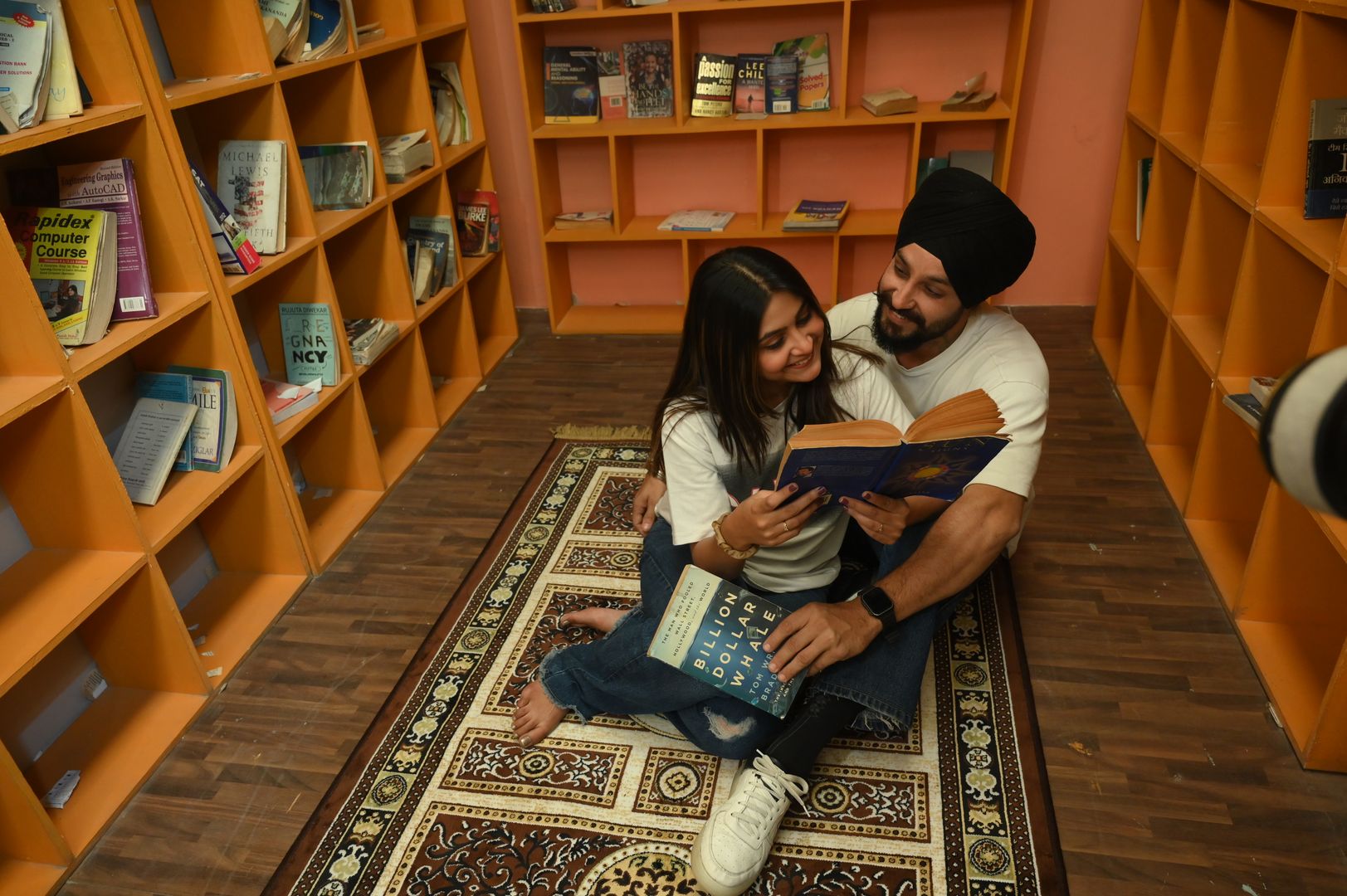 Cozy Library photoshoot set with elegant bookshelves and warm ambiance for sophisticated portrait sessions located in Nagpur SEDO