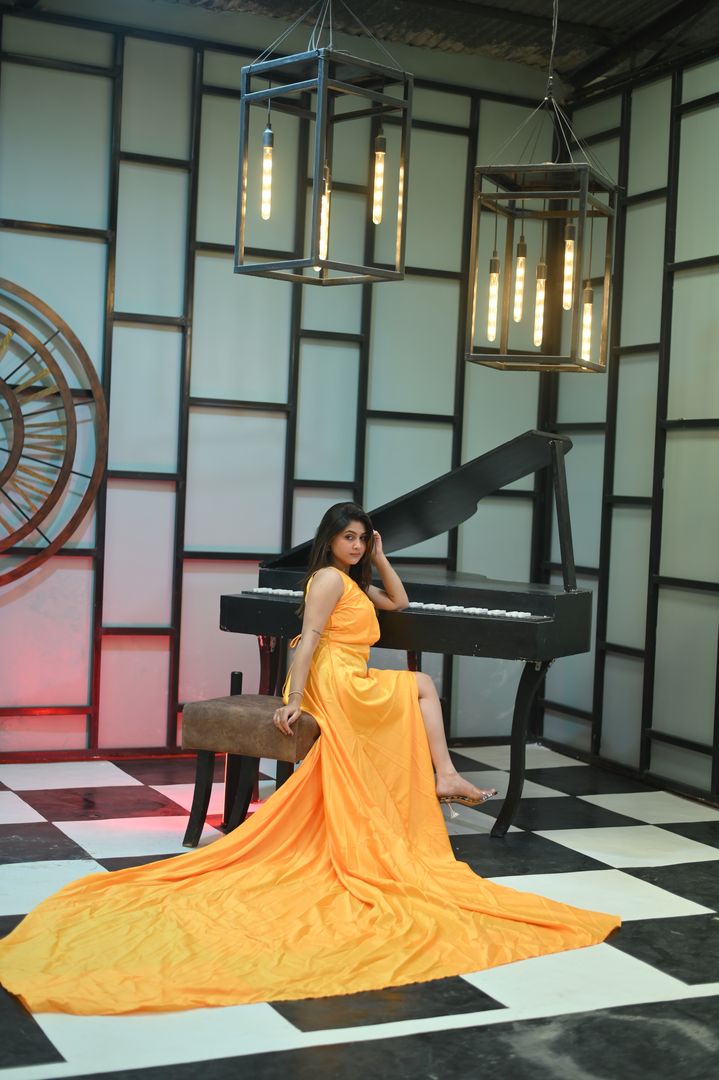 Melody Piano music themed photoshoot set with grand piano and vintage clock for sophisticated portrait sessions located in Nagpur SEDO