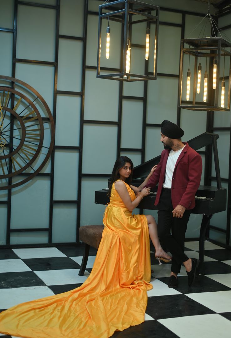 Melody Piano music themed photoshoot set with grand piano and vintage clock for sophisticated portrait sessions located in Nagpur SEDO