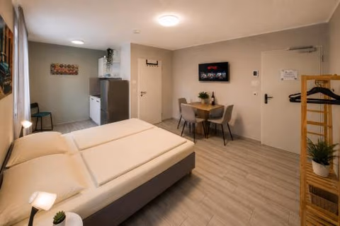 Hotel Prime Living Apartments Küche Netflix — foto 6