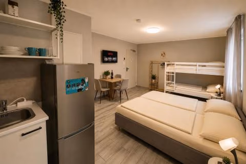 Hotel Prime Living Apartments Küche Netflix — foto 7