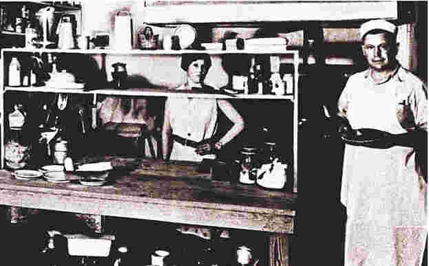 A young Sanders cooking fried chicken in Sanders Court and Café, Kentucky. (1932) 