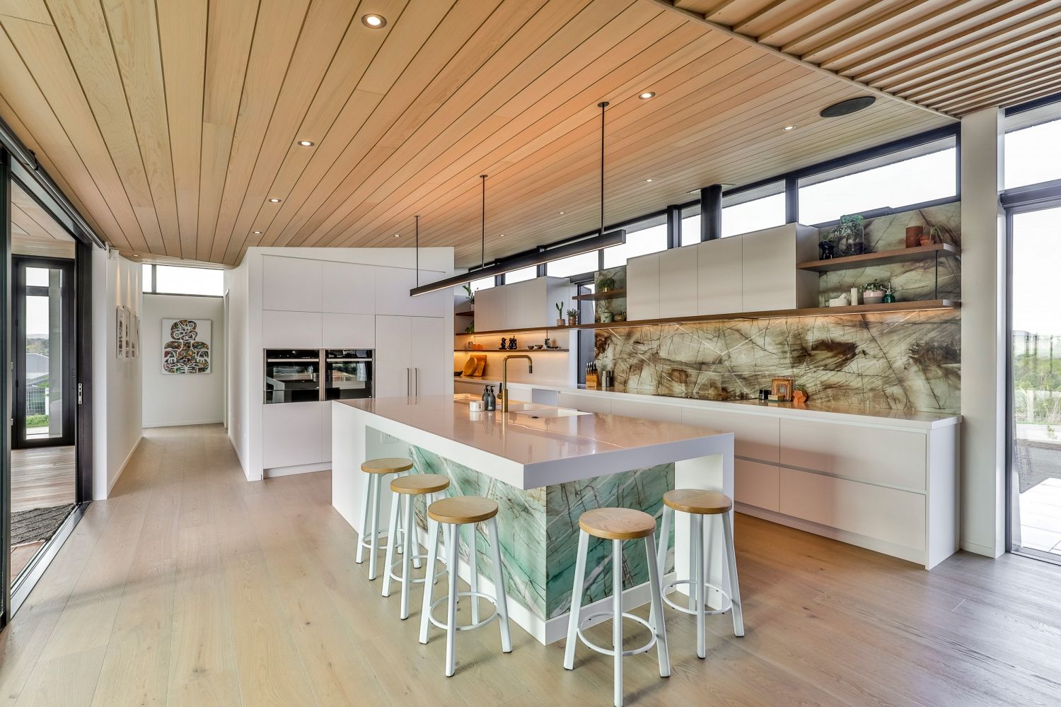 Modern kitchen featuring Macchiato quartz benchtops and custom cabinetry by Carlielle Kitchens