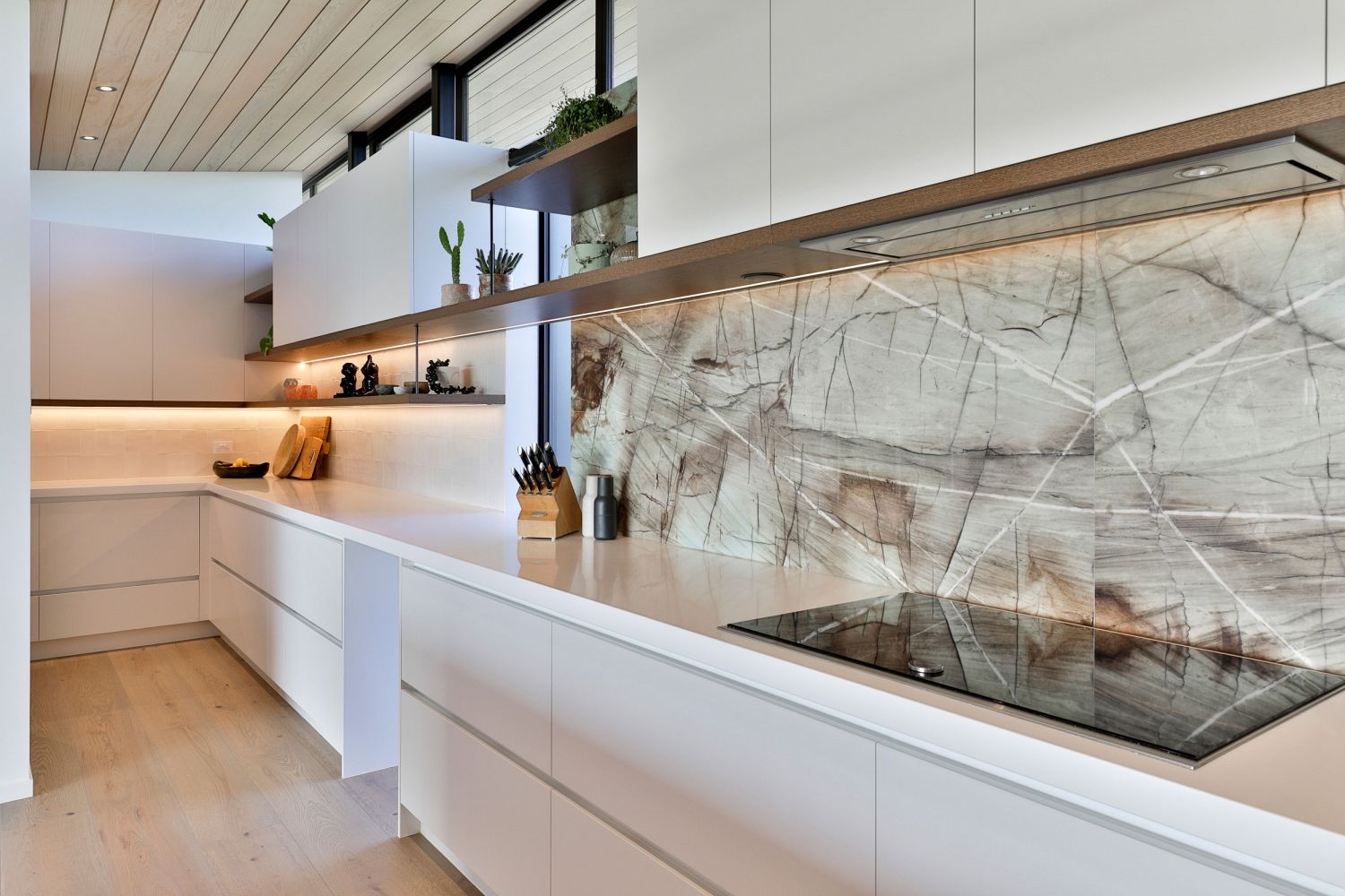 Elegant kitchen lighting fixtures complementing the modern design aesthetic.