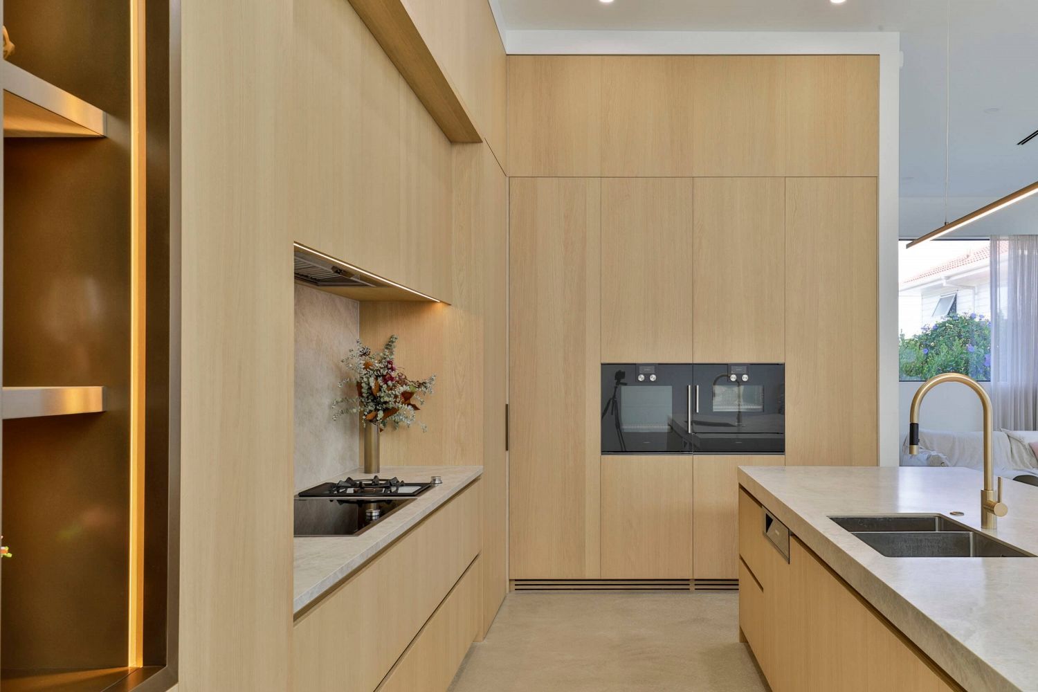 Floor-to-ceiling cabinetry forming a seamless architectural backdrop