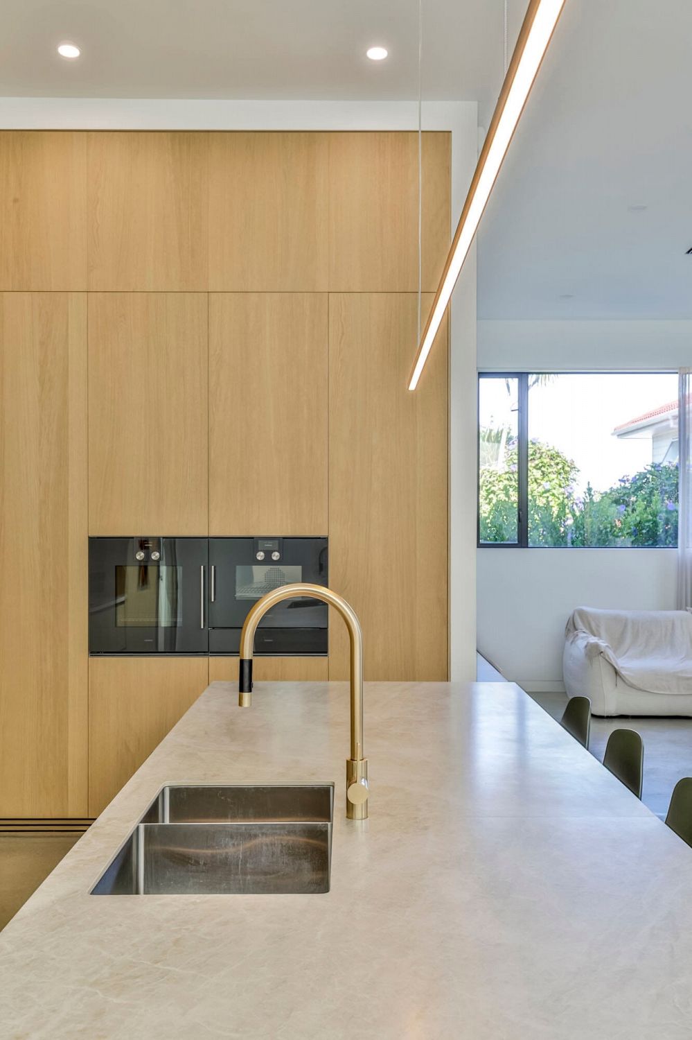 Kitchen island anchoring open-plan living space