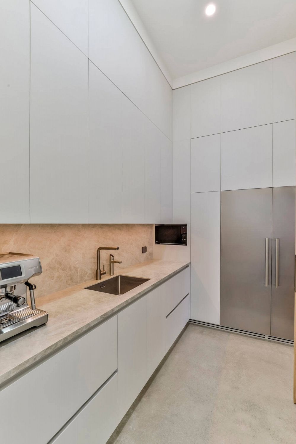 Scullery with full-height cabinetry and integrated storage solutions