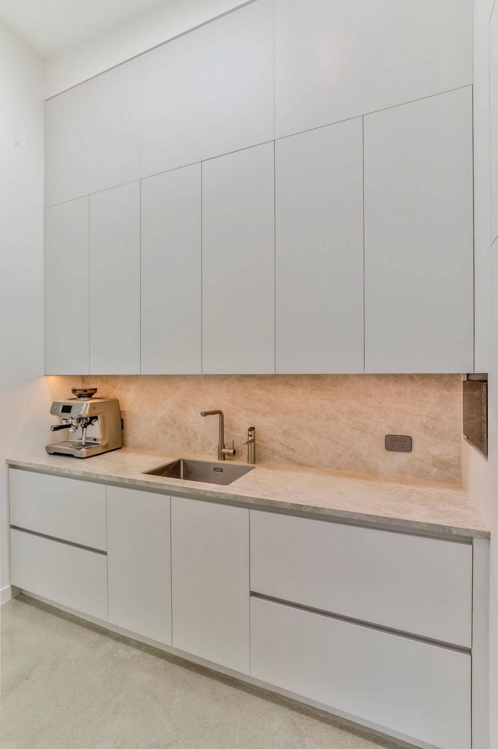 Durable matte white acrylic scullery joinery with clean, functional finish