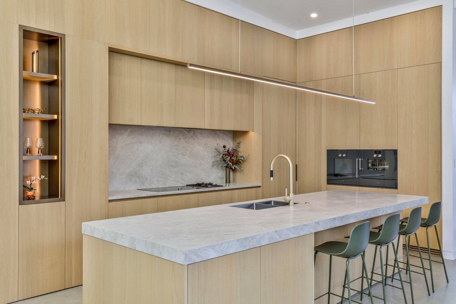 Precision junction between timber cabinetry and stone benchtop