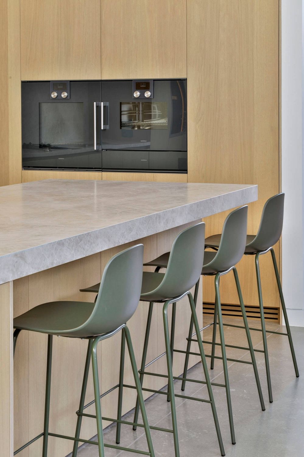 Warm material palette contrasted against clean painted wall surfaces