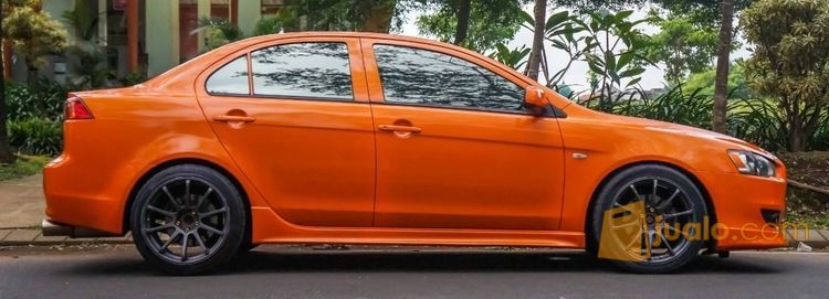 Mitsubishi Lancer EX Repaint Orange Xyralic Gold Jakarta 