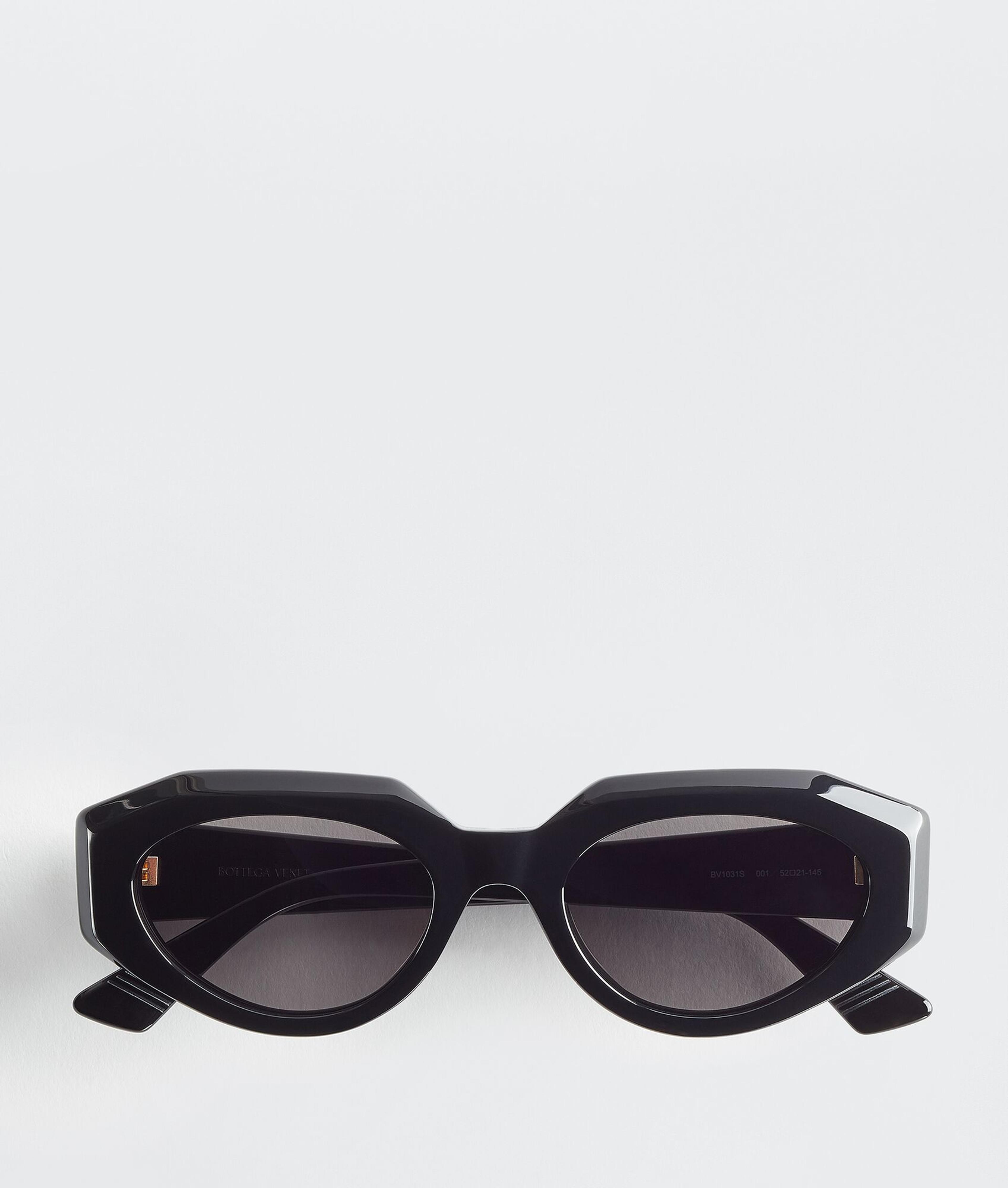 Bottega Veneta® Women's Facet Acetate Cat Eye Sunglasses in Black / Grey. Shop online now.