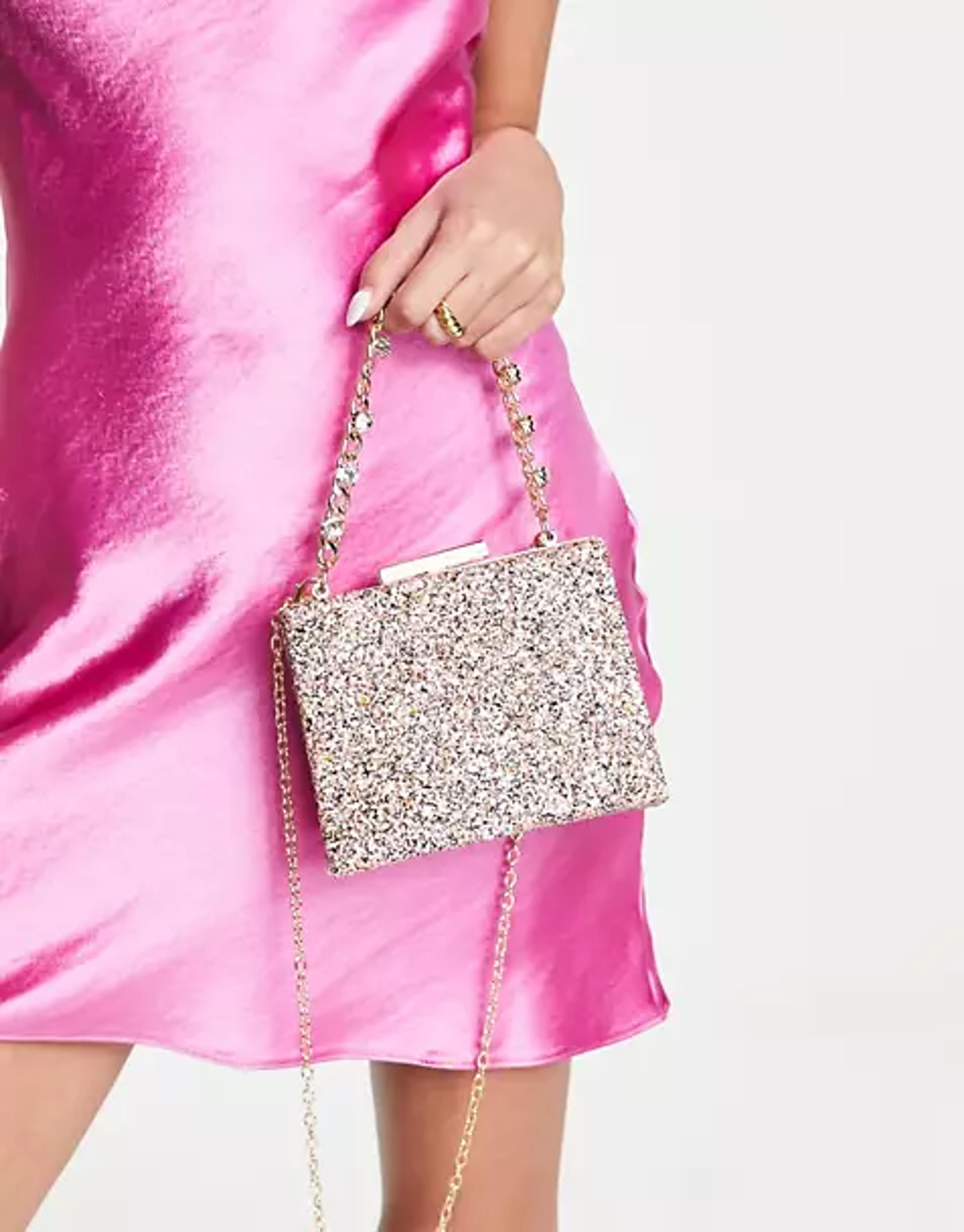 True Decadence clutch bag in pink glitter with chunky chain grab handle | ASOS