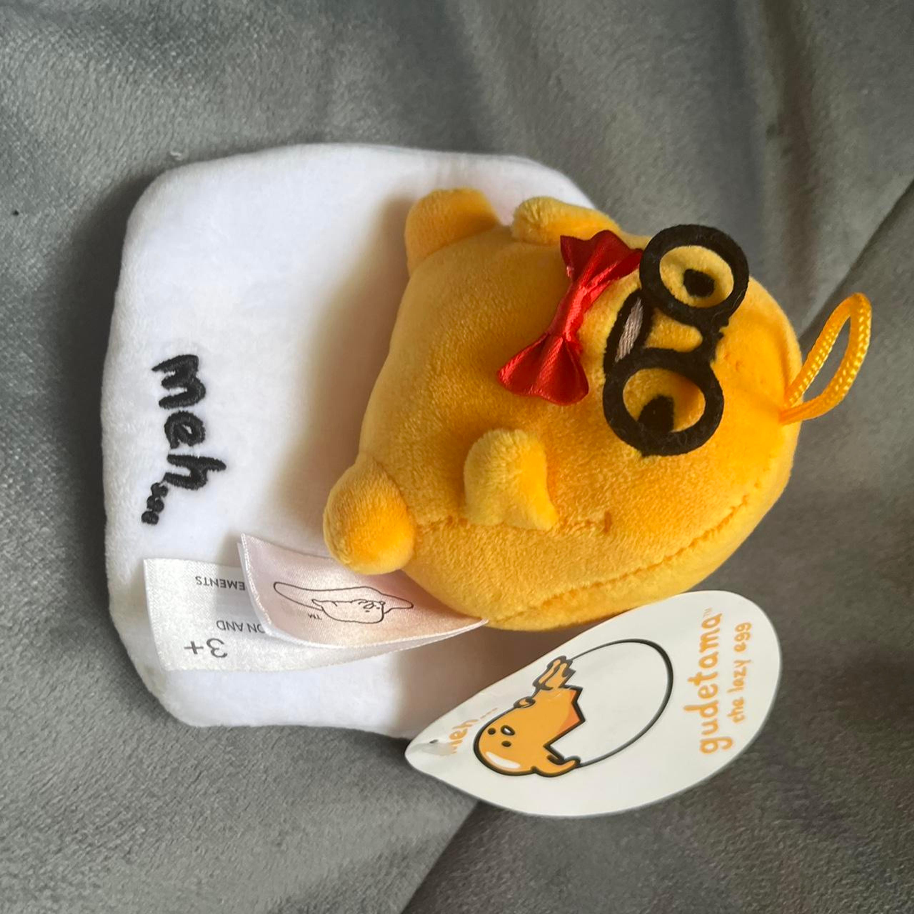 Gudetama egg keychain plushie with glasses and bow -...