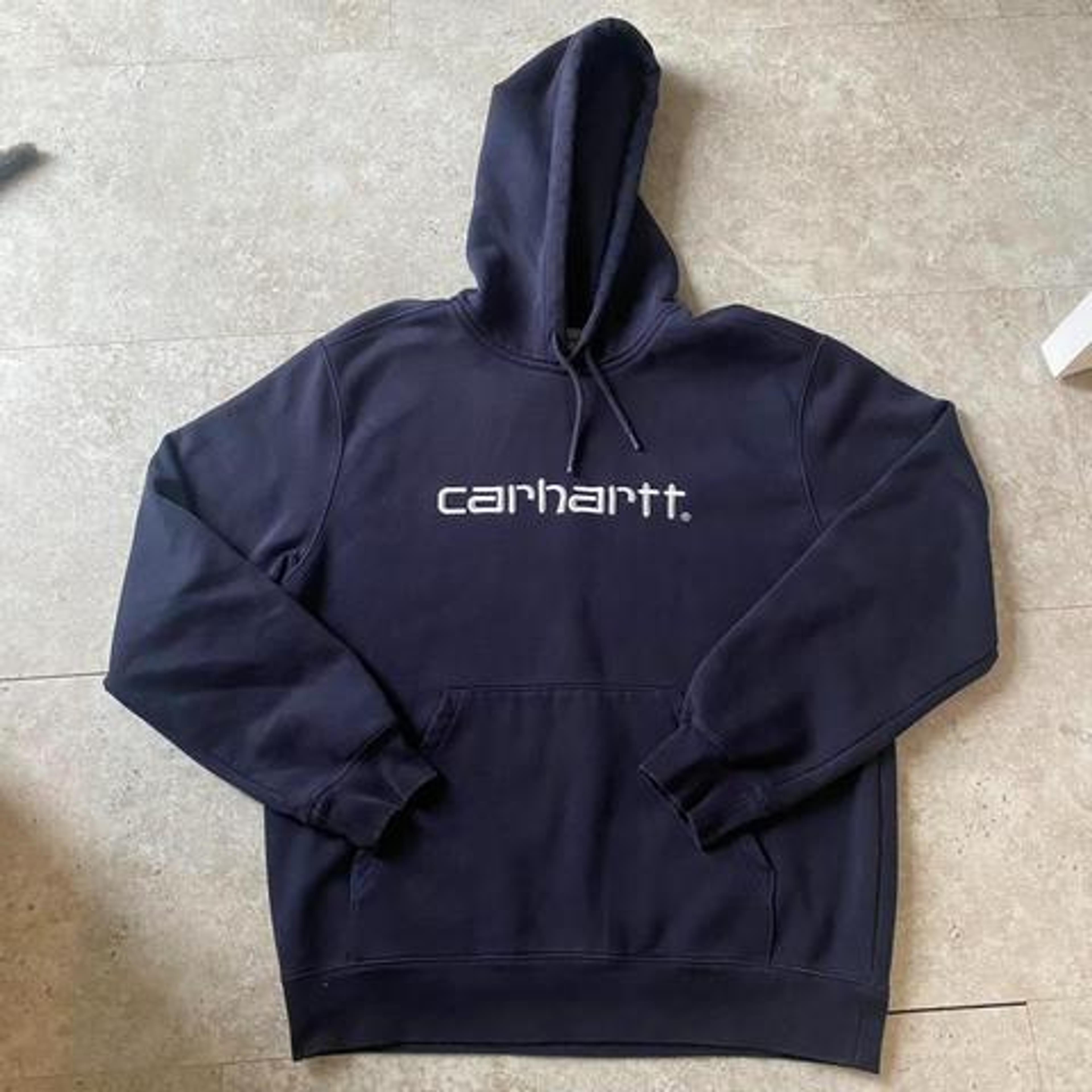 Carhartt dark navy hoodie with spell out logo size... - Depop