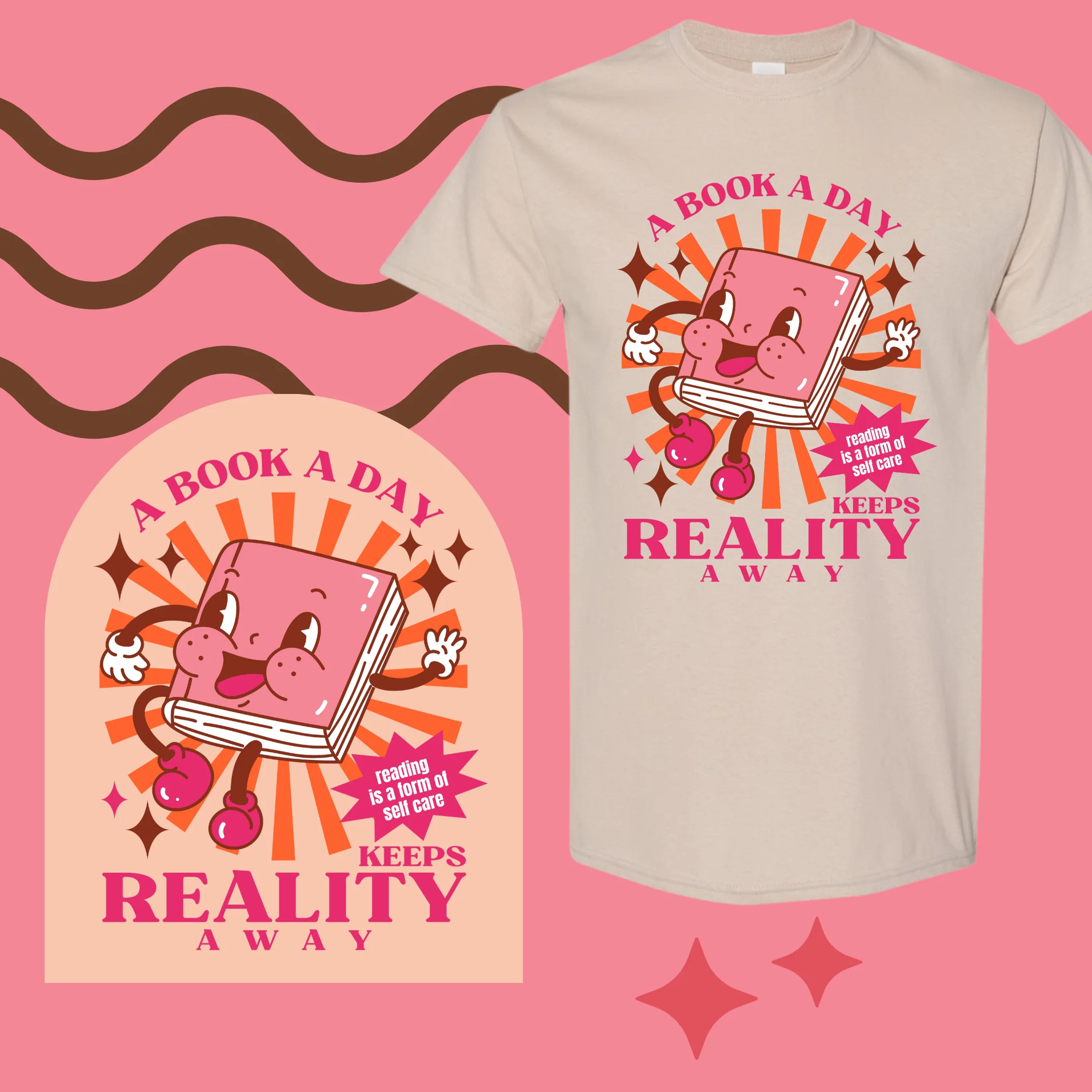 A BOOK A DAY KEEPS REALITY AWAY TEE – Magic Magenta