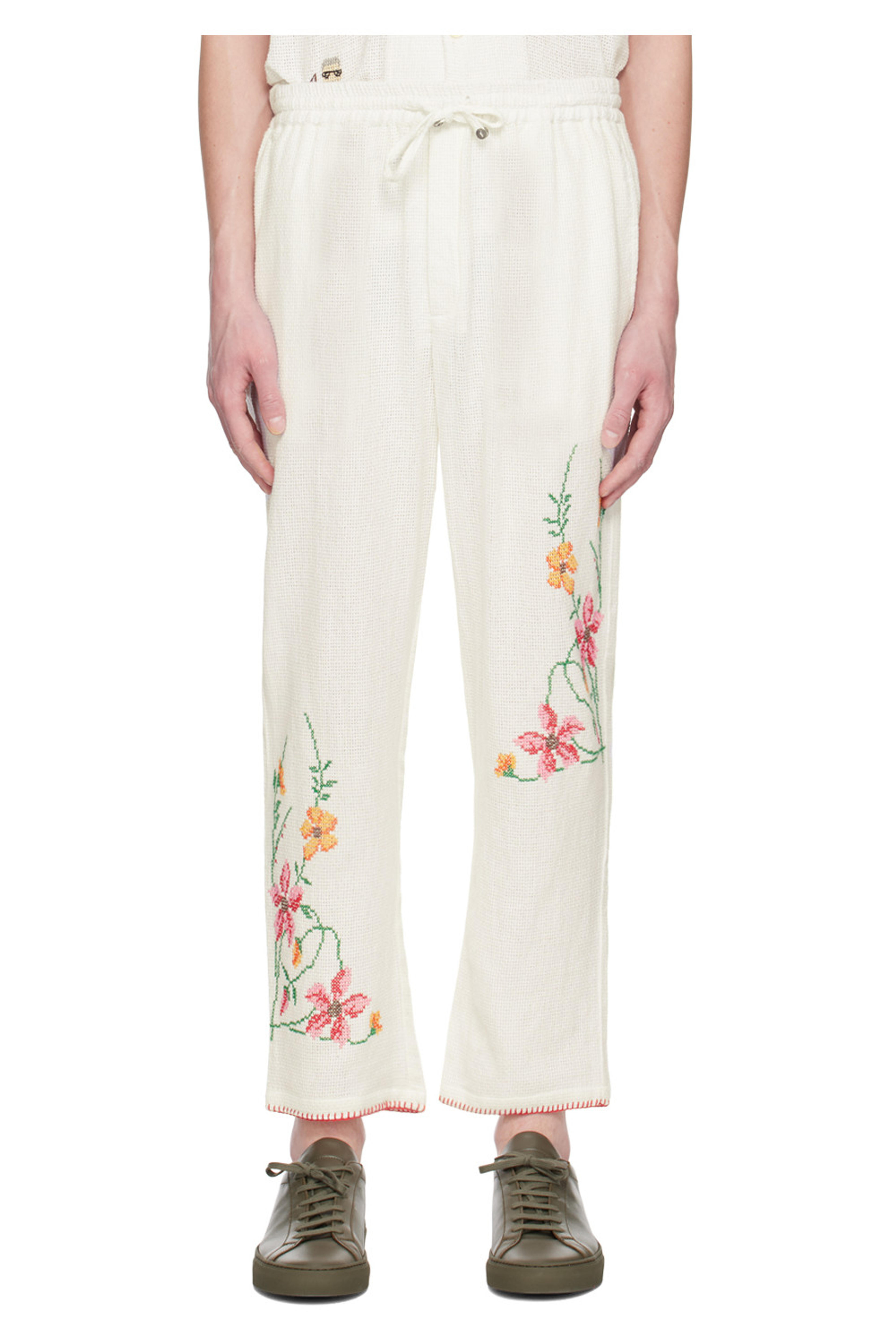 White Embroidered Trousers by HARAGO on Sale