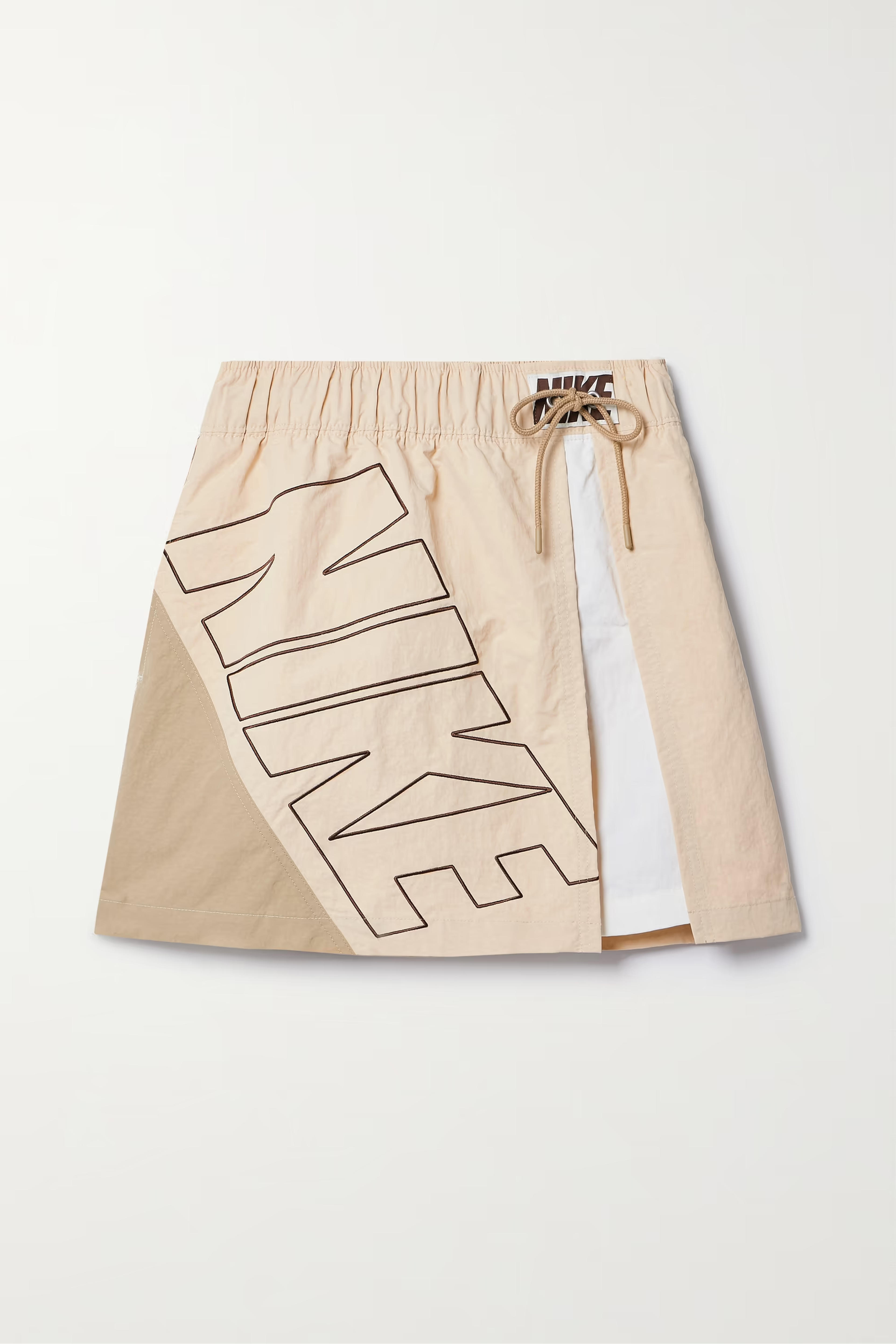 NIKE Paneled embroidered shell mini skirt