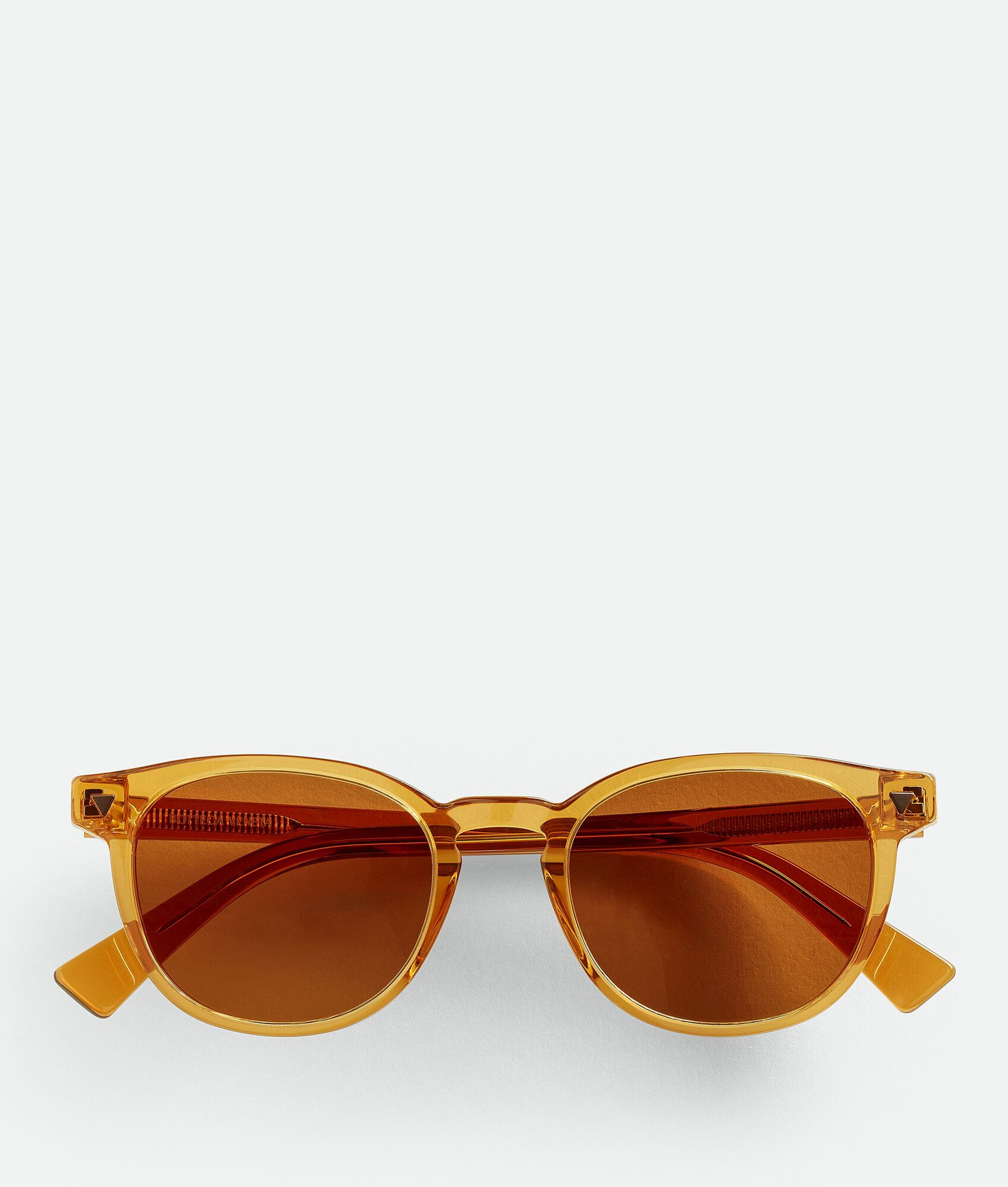 Bottega Veneta® Men's Soft Recycled Acetate Panthos Sunglasses in Yellow / Brown. Shop online now.