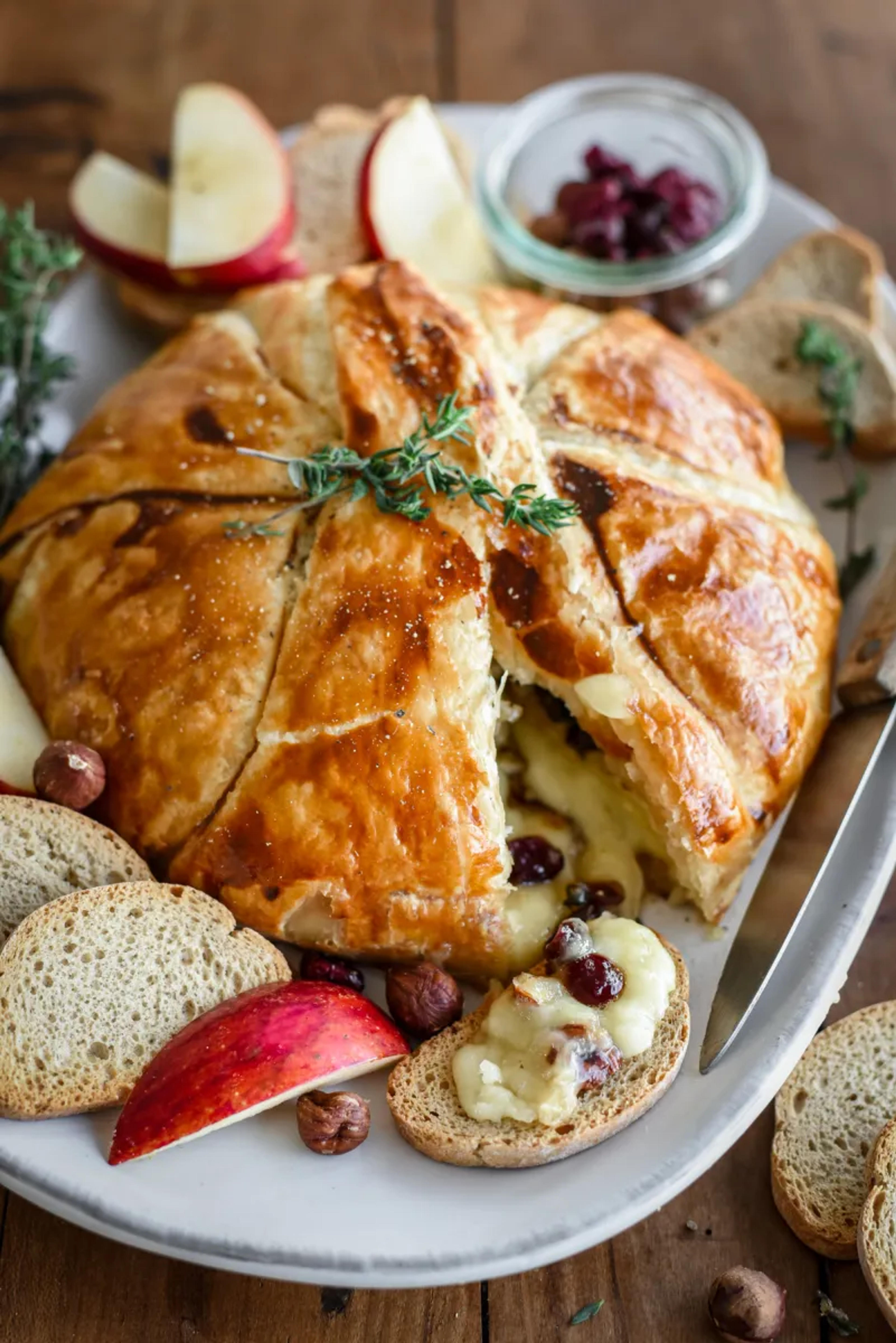 Brie en Croûte with Cranberries, Nuts and Thyme - Pardon Your French