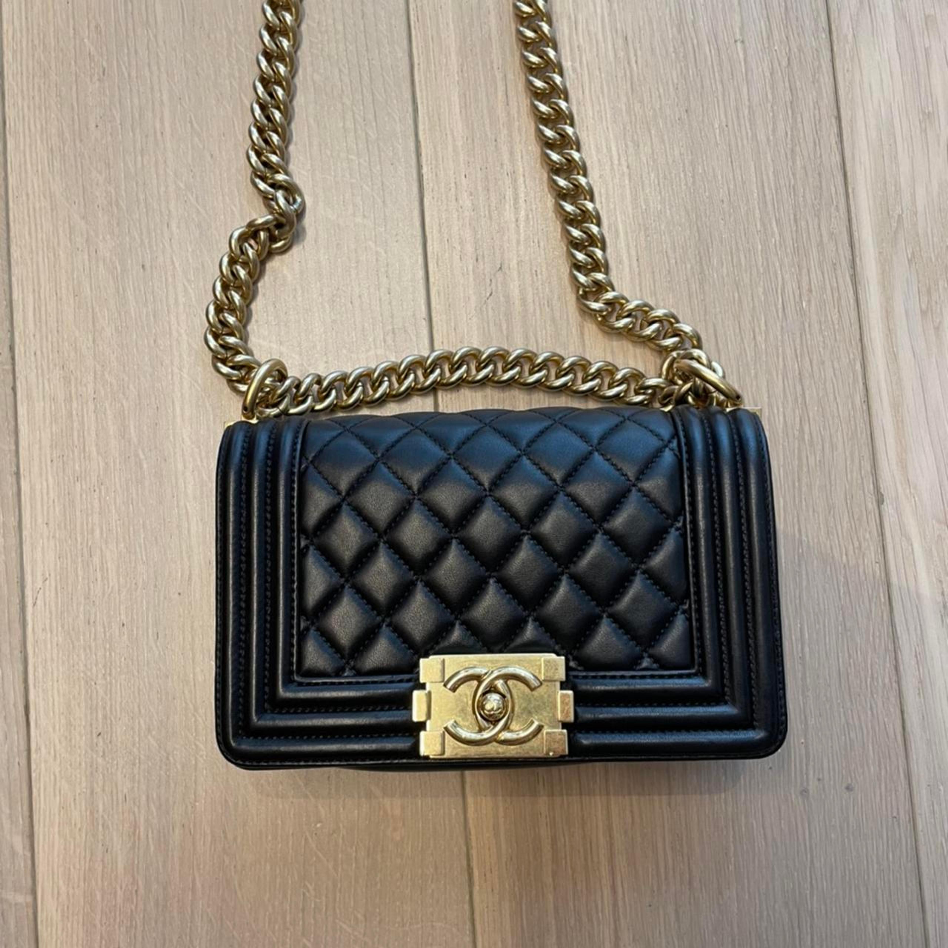 Chanel boy crossbody bag in black with gold metal... - Depop