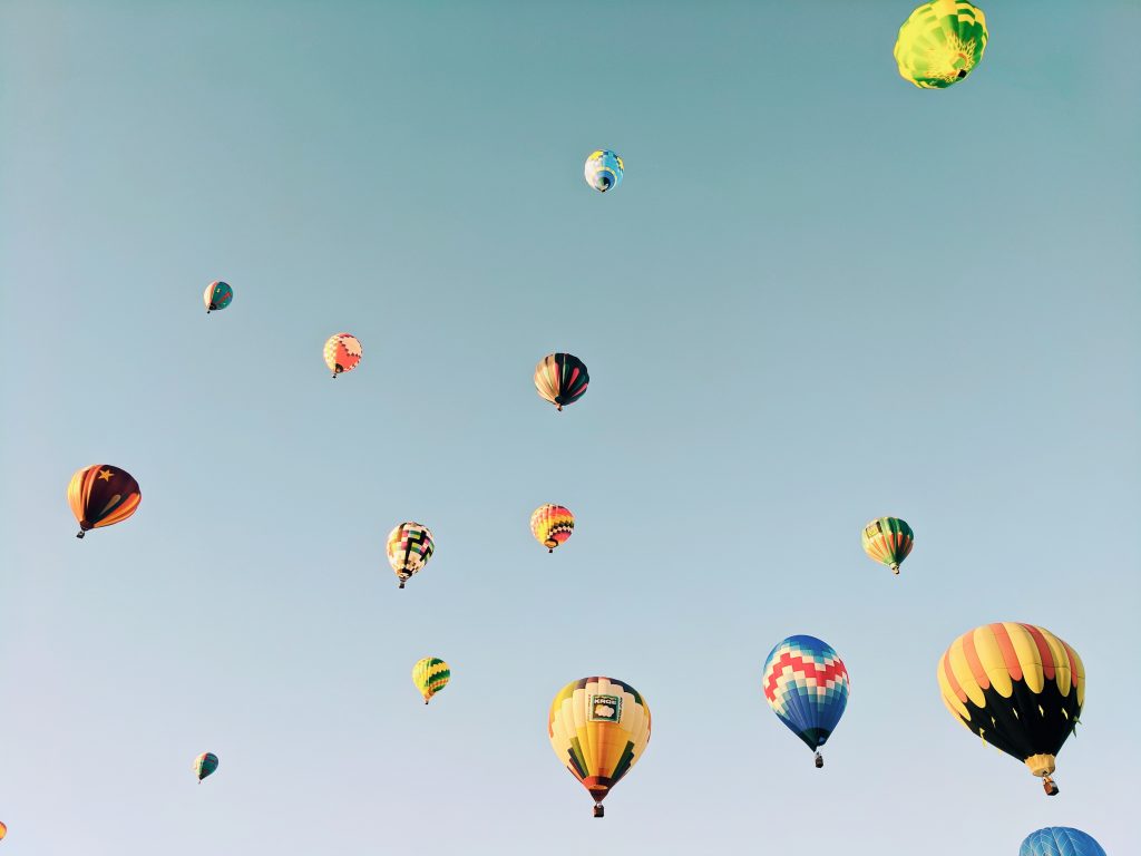 Colourful hot air balloons in the sky show creativity is essential for staying productive all the time.