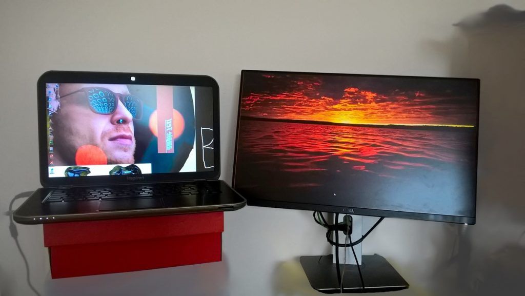 My dual monitor setup involving my laptop and desktop side-by-side