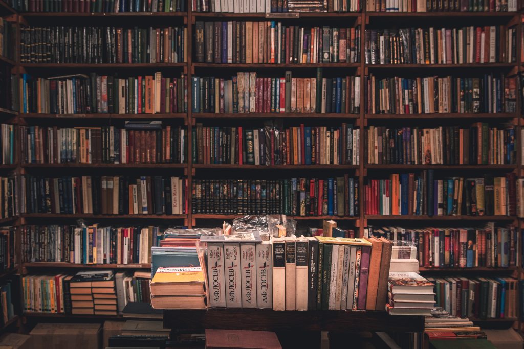 Many bookshelves filled with stacks of books