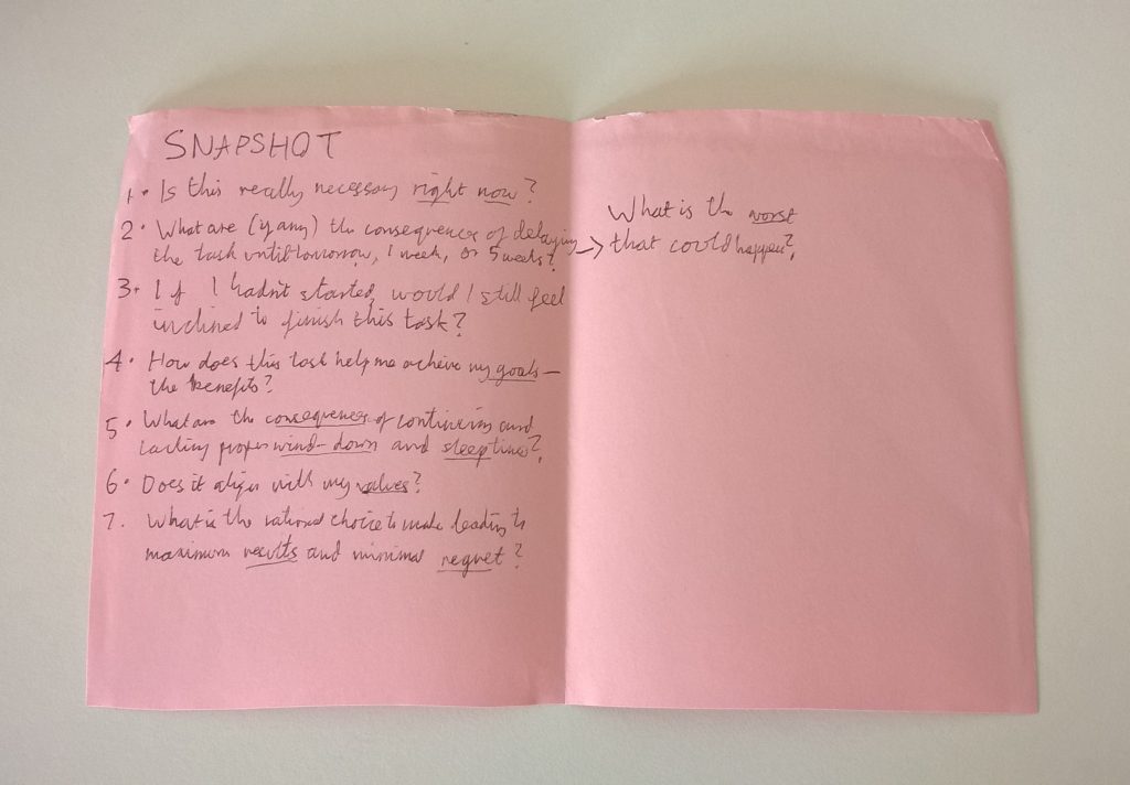 Writing out questions on a pink sheet helps me fight sleep procrastination.