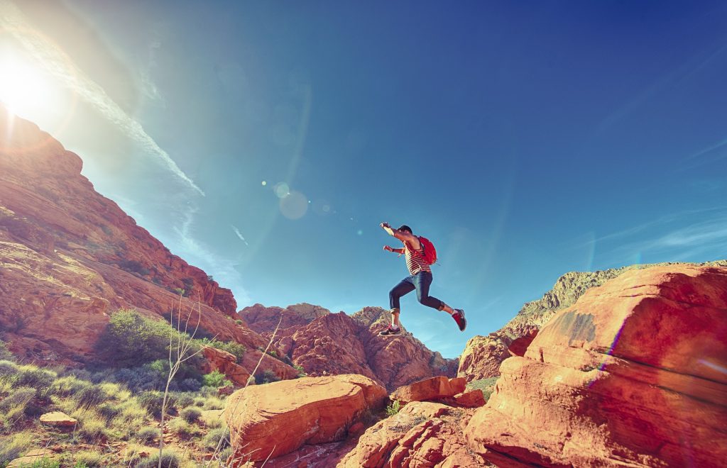 Joyful person having fun and disengaging from work as a way to avoid burnout.