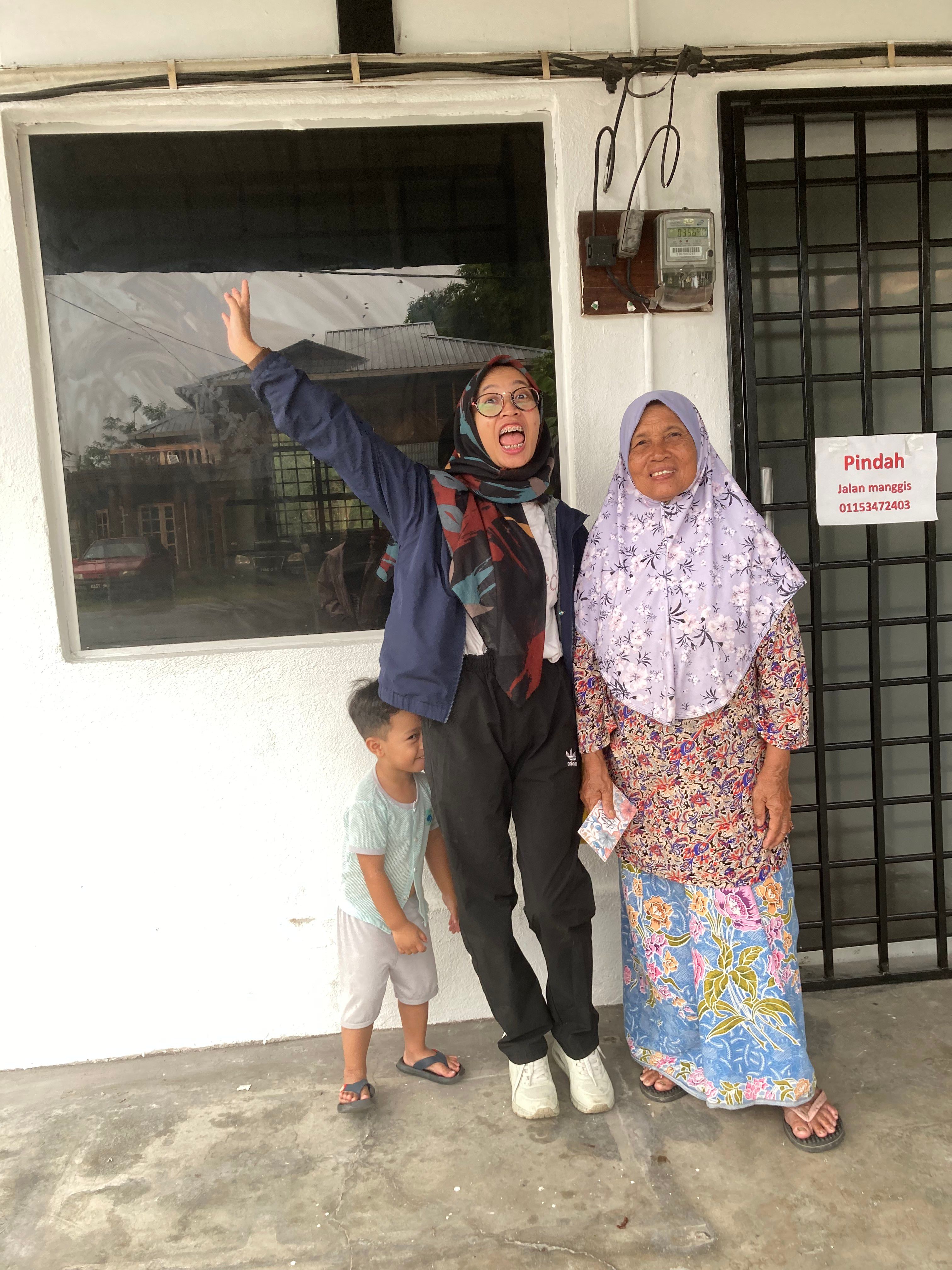 Shafira with her grandmother and a child