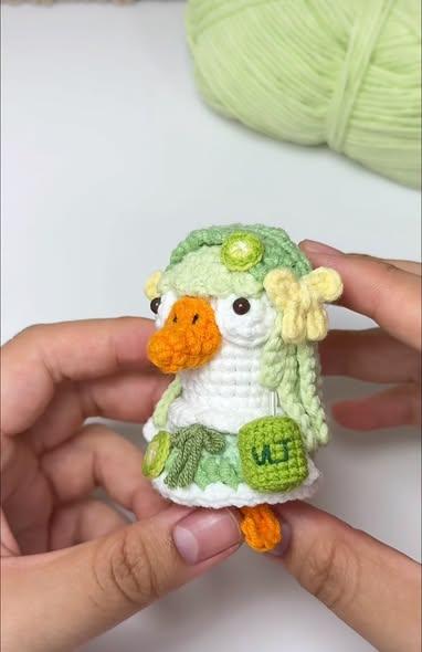Bé vịt tóc xanh nơ hoa