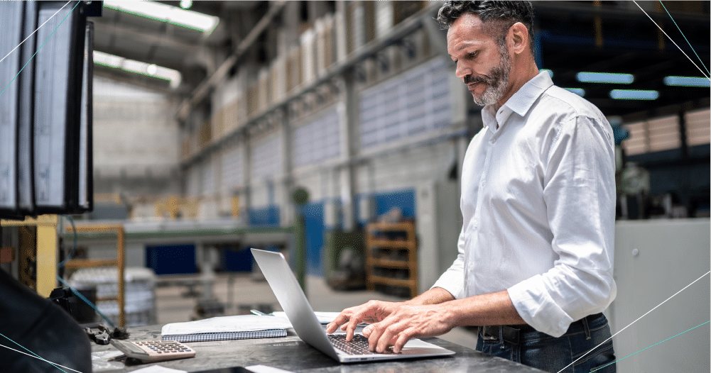 Employee using a laptop for an EDI transaction.