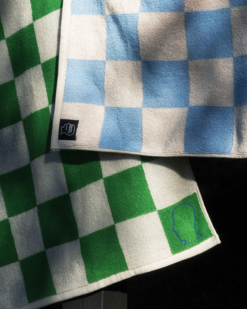 two dish towels with checkerboard patterns