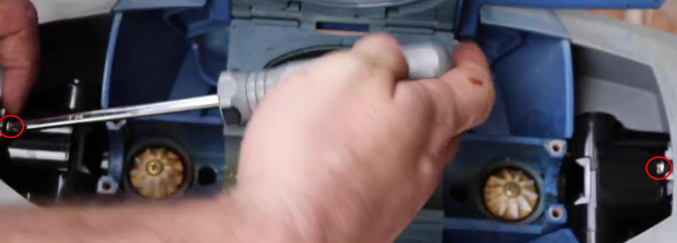 Screenshot 2026-04-15 112939 Am - Diy Pool Resources - Inyopools.com Close-up of a person using a screwdriver to work inside a blue plastic mechanism, with visible gold gears and internal components.