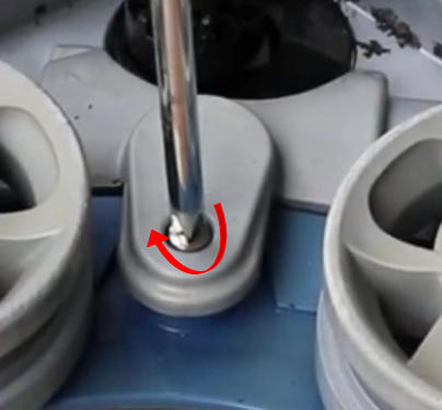 Screenshot 2026-04-23 100004 Am - Diy Pool Resources - Inyopools.com Close-up of a bolt and nut on a gray base being tightened with a tool, with a red arrow indicating clockwise rotation.