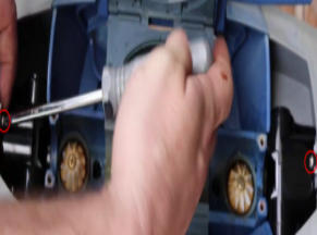Screenshot 2026-04-28 93003 Am - Diy Pool Resources - Inyopools.com Close-up of a hand using a screwdriver to adjust a screw on a blue model vehicle chassis, mid-action repair.