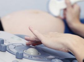 Pregnant girl doing on ultrasound examination