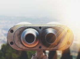 Touristic telescope look at the city with view of Barcelona Spain, close up old metal binoculars on background viewpoint overlooking the mountain, hipster coin operated in panorama observation, mockup