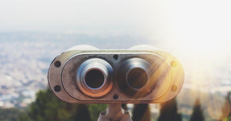 Touristic telescope look at the city with view of Barcelona Spain, close up old metal binoculars on background viewpoint overlooking the mountain, hipster coin operated in panorama observation, mockup