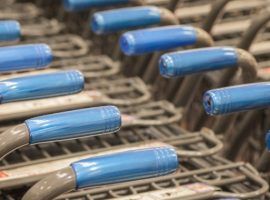 Rows of shopping carts at supermarket entrance
