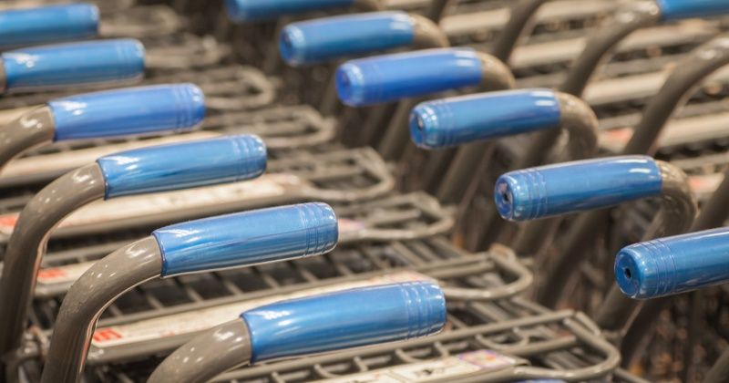 Rows of shopping carts at supermarket entrance