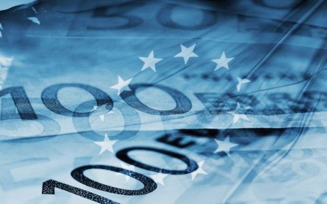 blue background with euro bills and european union flag symbolizing euro zone
