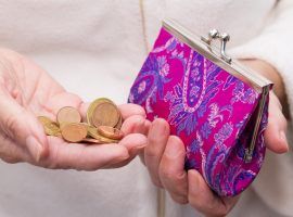 hand with coins saving on wallet