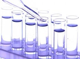 Dropper and test tubes, close up, isolated on white